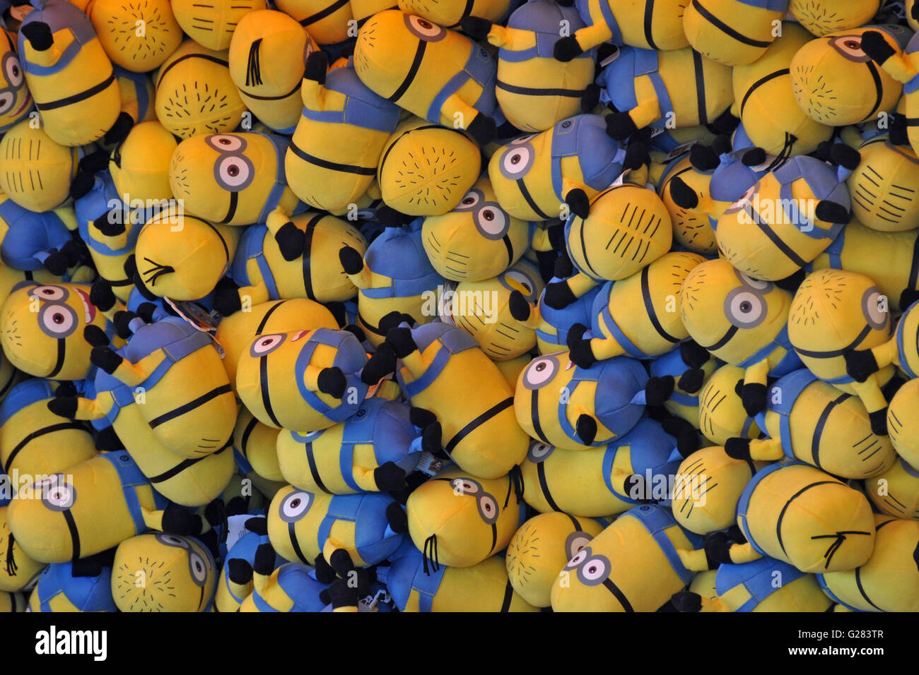 Cuddly toy Minions, prizes at a fairground stall Stock Photo