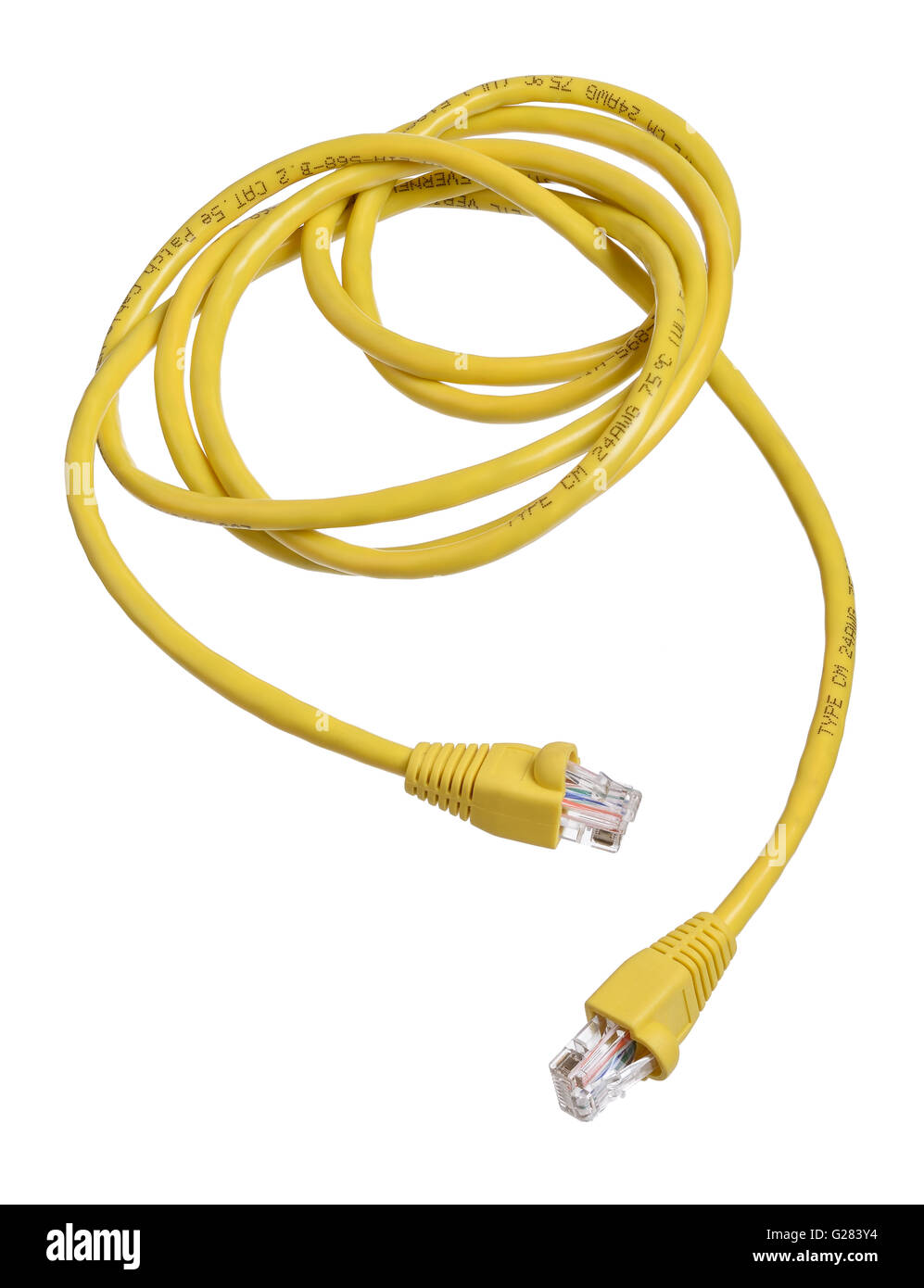 Yellow coiled and tangled ethernet data cable Stock Photo