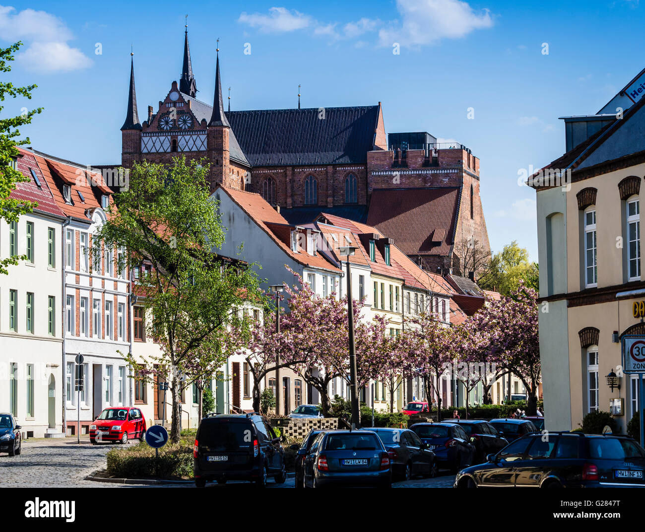 St. Georgen church, seen over row of houses, Wismar, Mecklenburg-Vorpommern, Germany Stock Photo