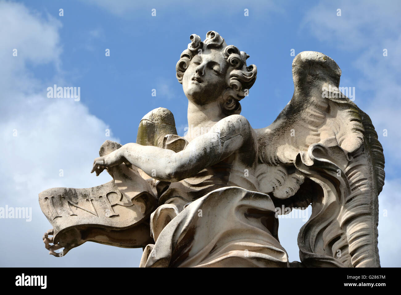 Beautiful marble angel with INRI sign from Sant'Angelo bridge, in the center of Rome Stock Photo