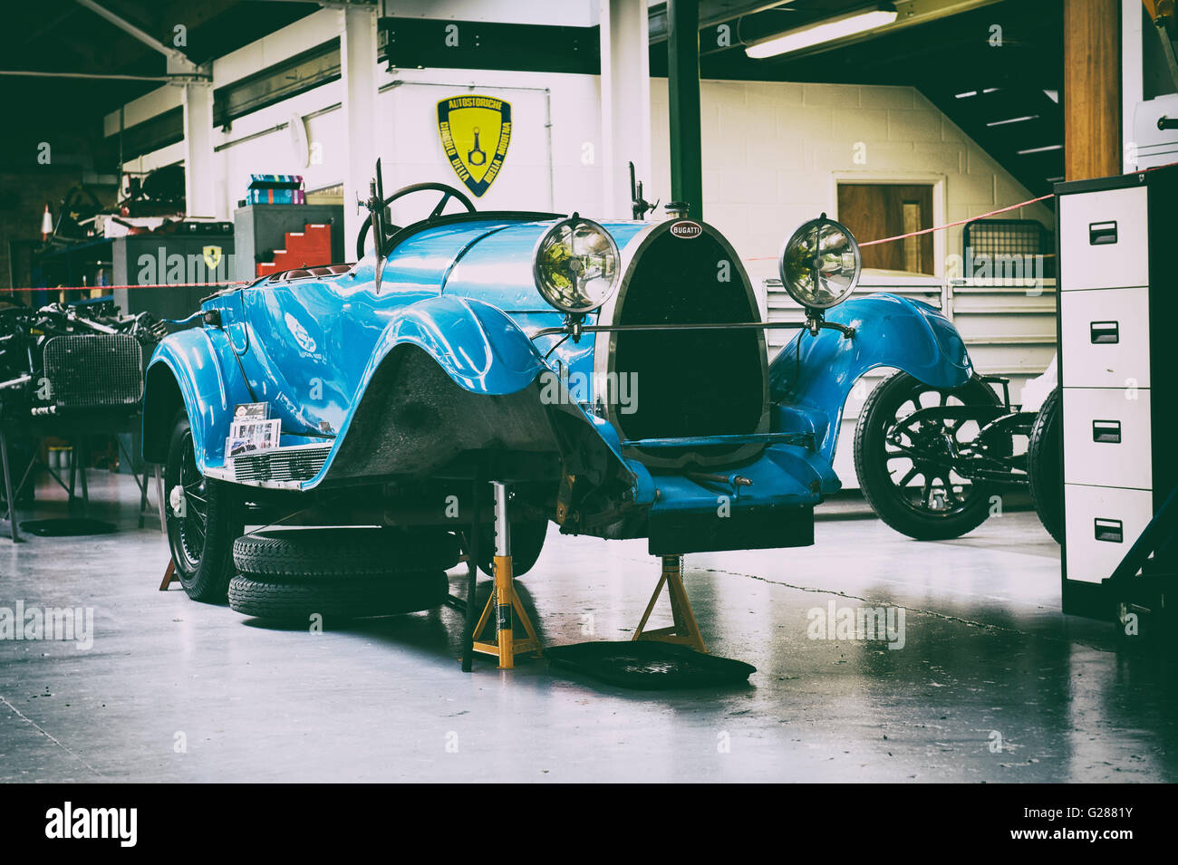 Vintage Bugatti in a restoration garage at Bicester Heritage Centre. Oxfordshire, England. Vintage filter applied Stock Photo