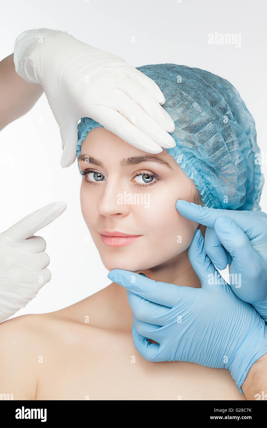 Attractive woman at plastic surgery with syringe in her face Stock ...