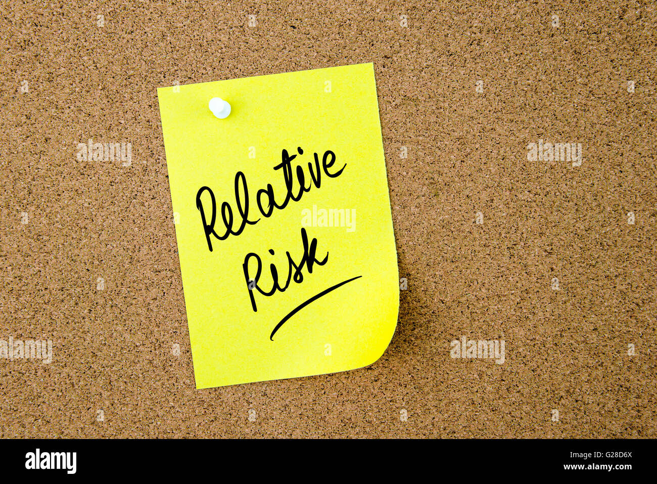 Relative Risk written on yellow paper note pinned on cork board with white thumbtack, copy space available Stock Photo