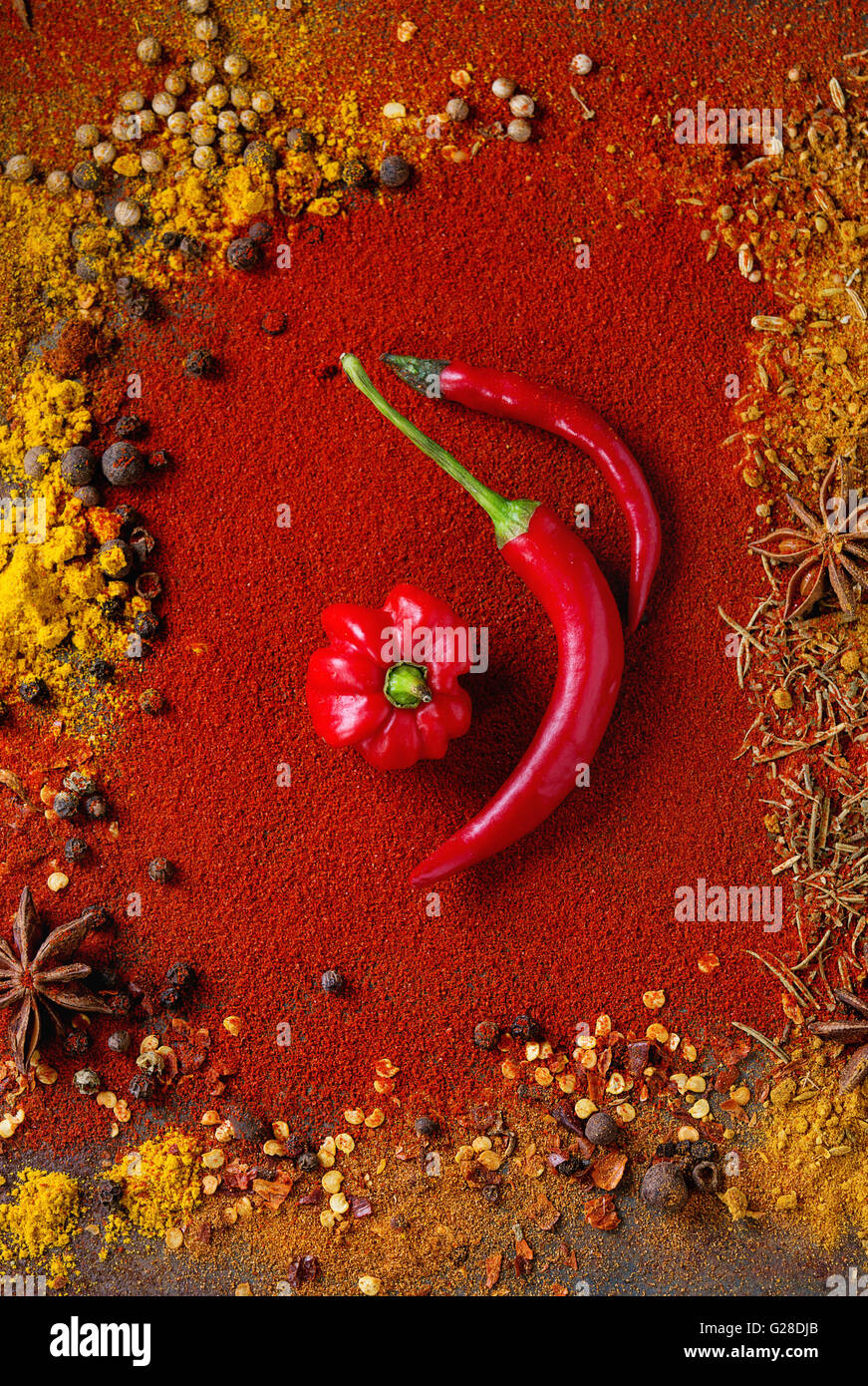 Spicy background with chili peppers Stock Photo