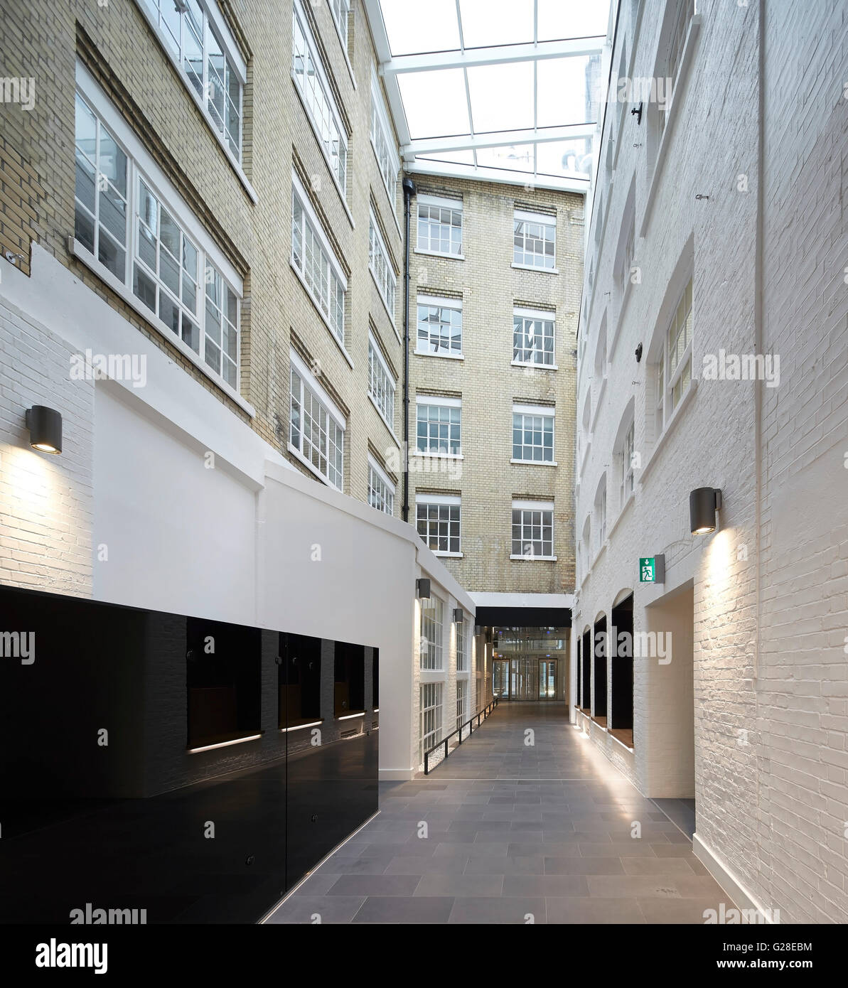 Internal street linking building volumes. Heal's, Torrington Place, London, United Kingdom. Architect: John McAslan & Partners, Stock Photo