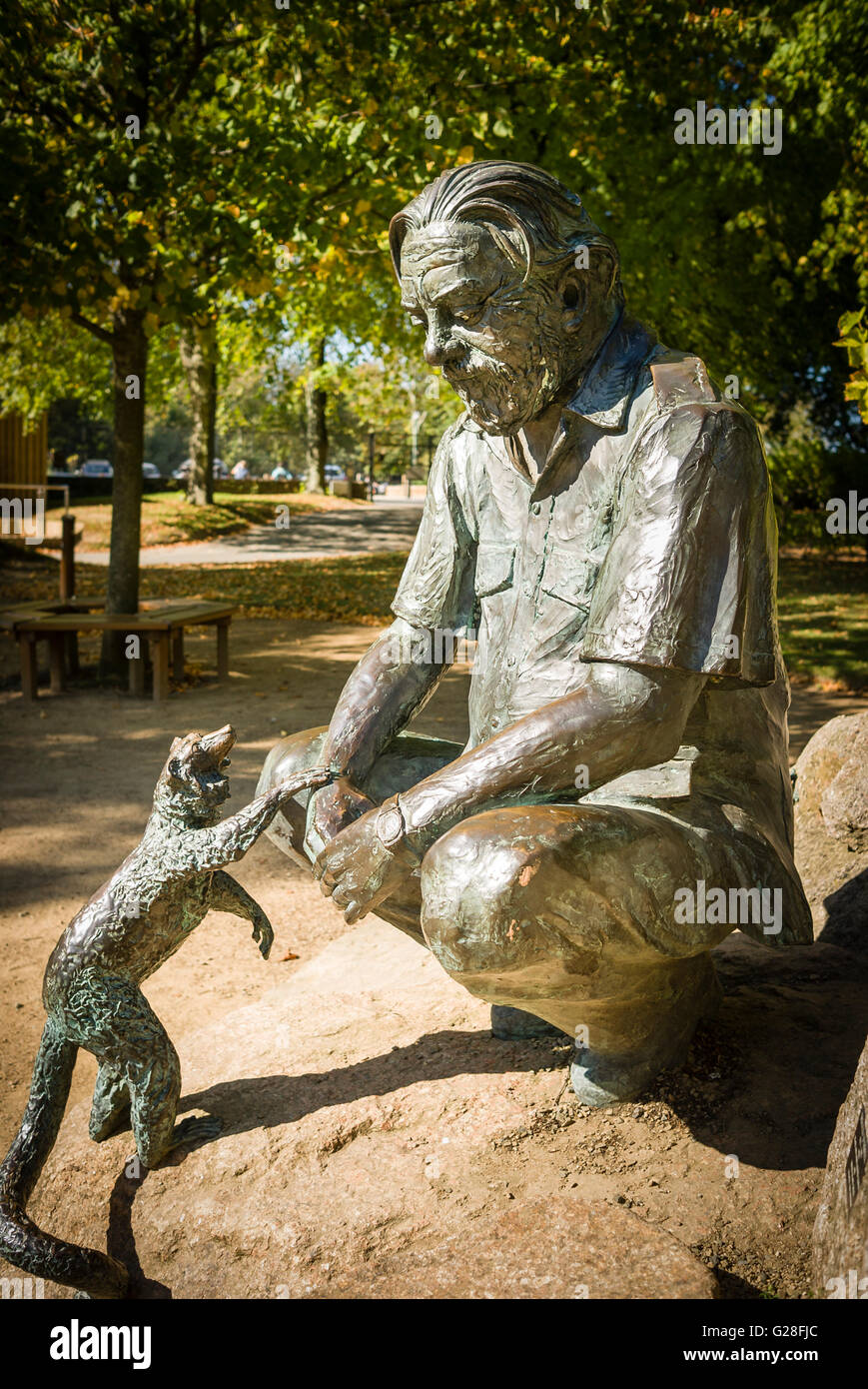Statue showing Gerald Durrell with tame mammal in his conservation park on Jersey UK Stock Photo