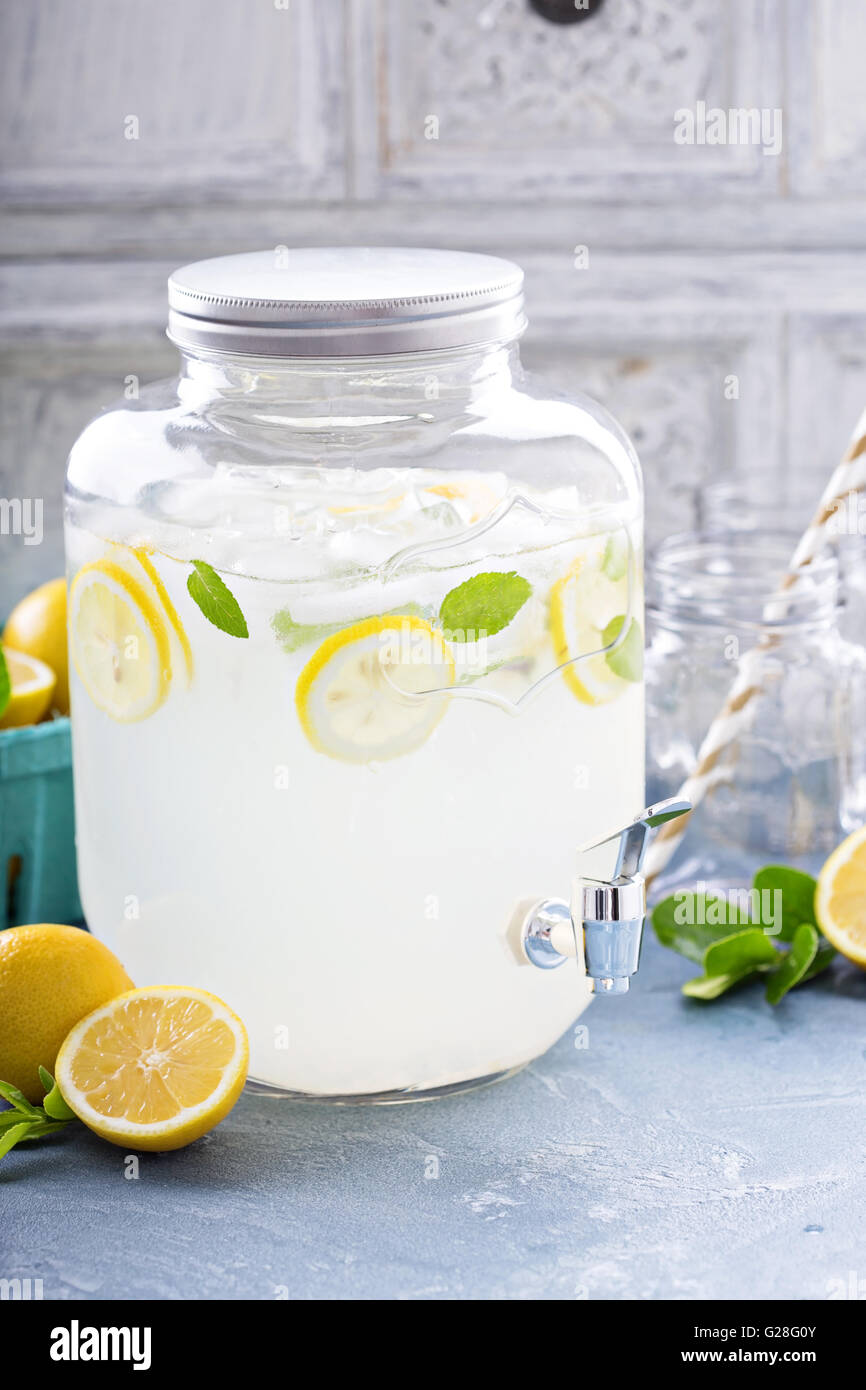 Fresh citrus lemonade in beverage dispenser Stock Photo Alamy