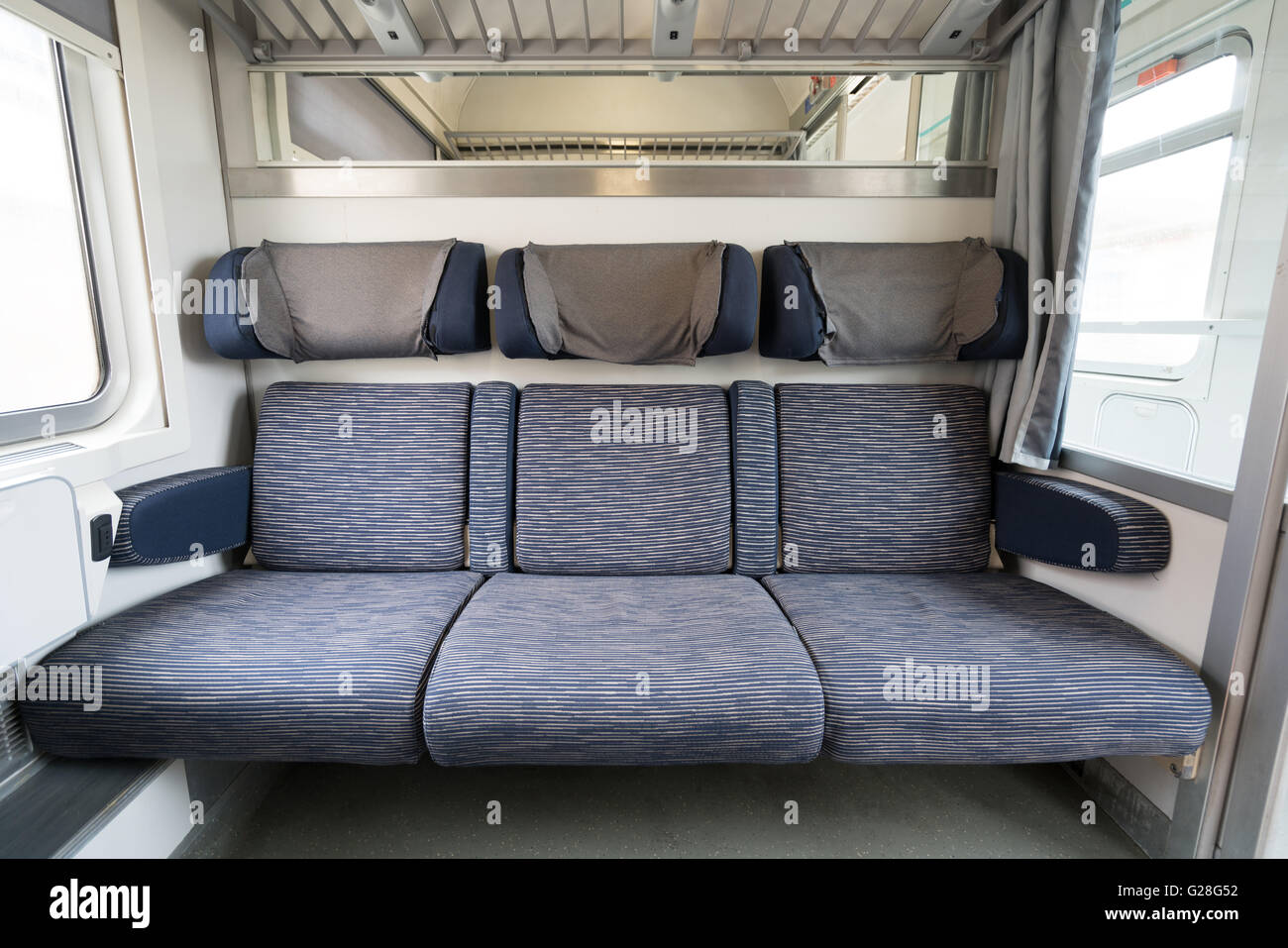 Three adjacent empty seats on modern European train Stock Photo