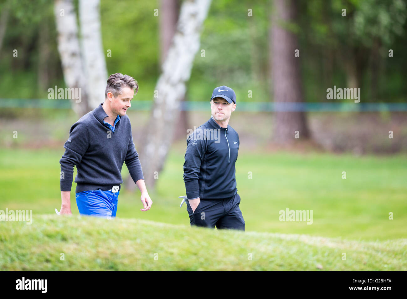 WENTWORTH, UK: May, 25, 2016 Tom Chaplin (left) and Ronan Keating (right) play in the BMW PGA Celebrity Pro-Am at Wentworth. Stock Photo