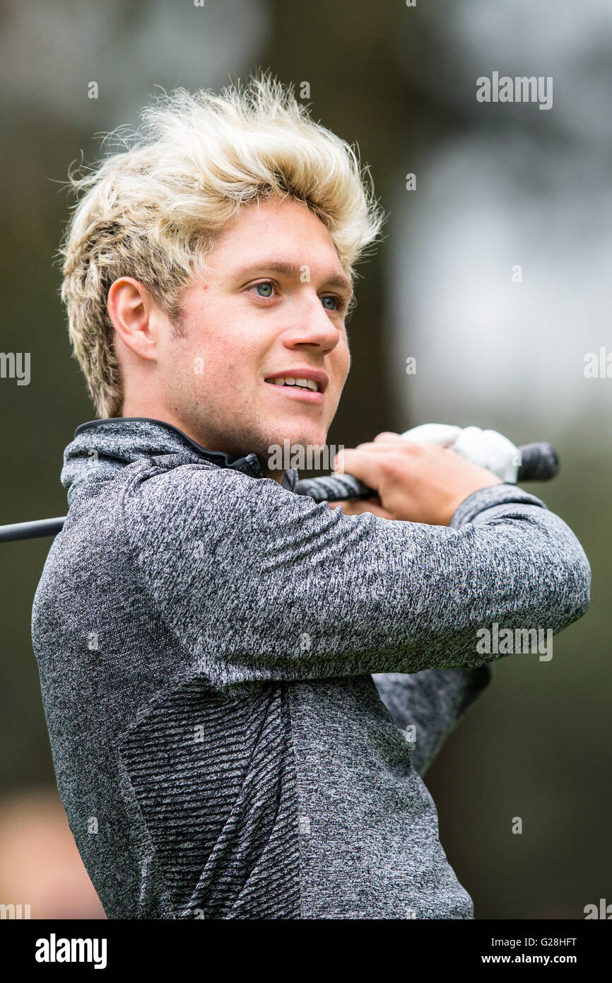 WENTWORTH, UK: May, 25, 2016 Niall Horan plays in the BMW PGA Celebrity Pro-Am at Wentworth. Stock Photo