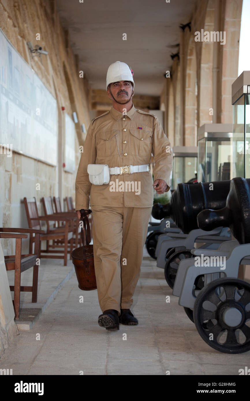 A reenactor in British military fatigues at the Saluting Battery in Valletta. Stock Photo