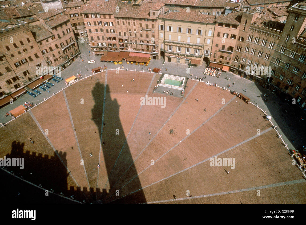 shadow of Torre del Mangia on Piazza del Campo, Siena Stock Photo