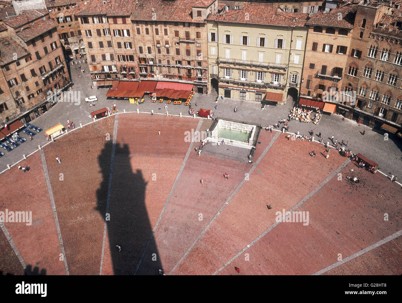 shadow of Torre del Mangia on Piazza del Campo in Siena (Tuscany) Stock Photo