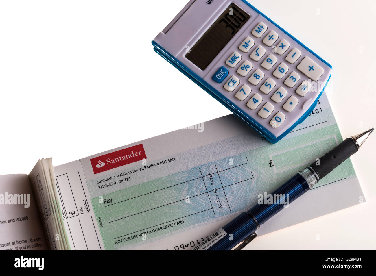 Cheque book and calculator. Stock Photo