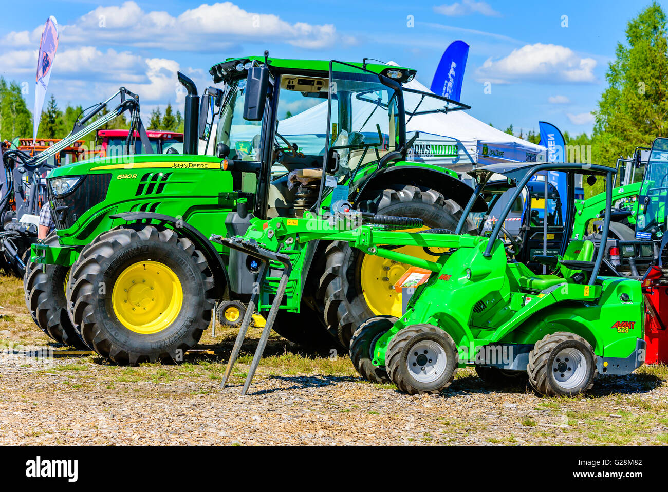 Emmaboda, Sweden - May 13, 2016: Forest and tractor (Skog och traktor) fair. Green Avant 528 loader tractor with forklift in fro Stock Photo