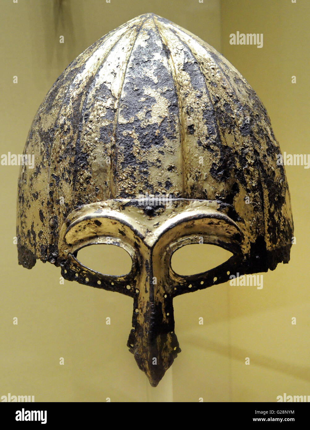 Period of Golden Horde (Ulus Jochi). 13th-14th c. Helmet with a half-mask, eye slits and nose guard. Iron, gilding. The State Hermitage Museum. Saint Petersburg. Russia. Stock Photo