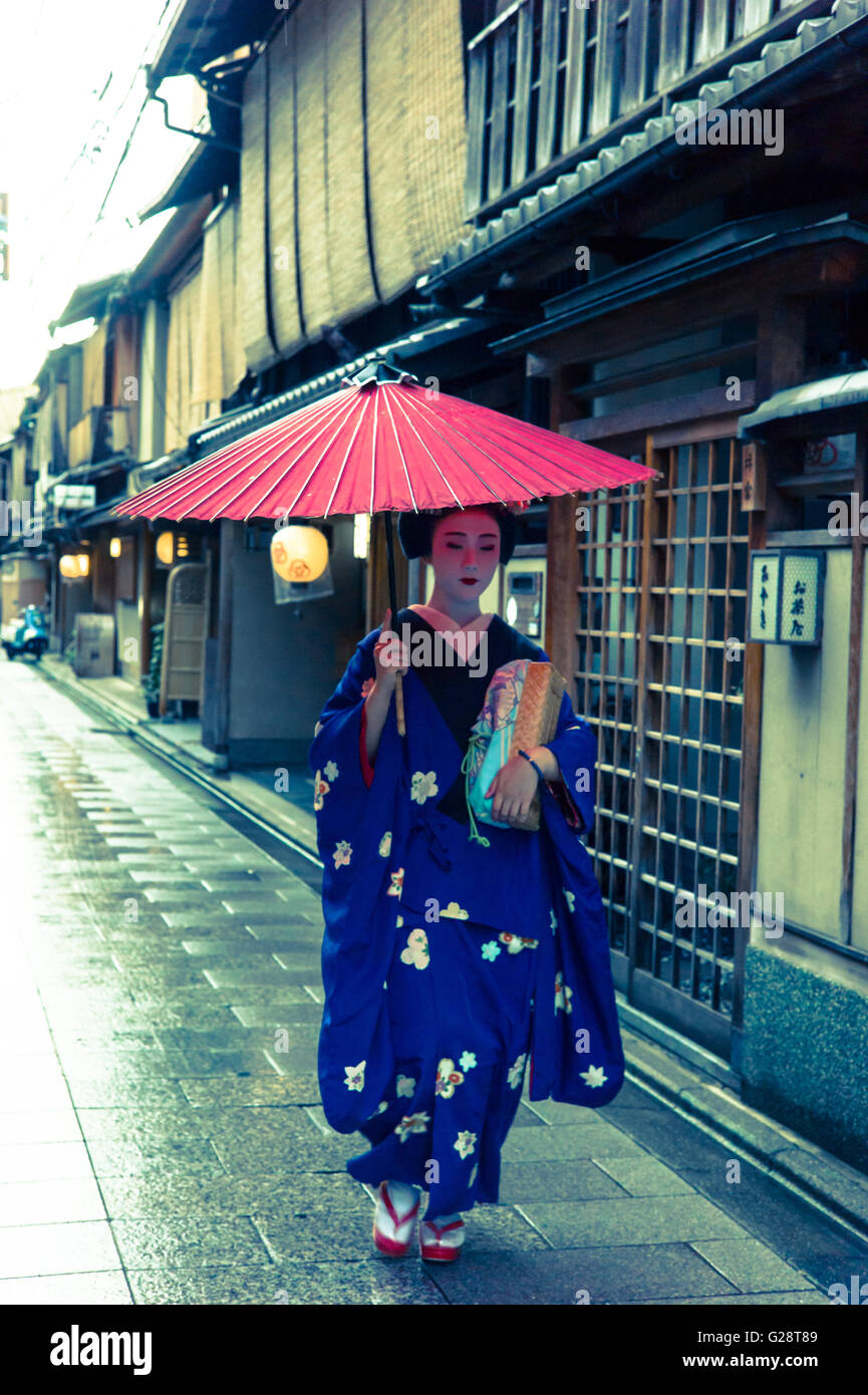 a geisha is walking in Kyoto Stock Photo