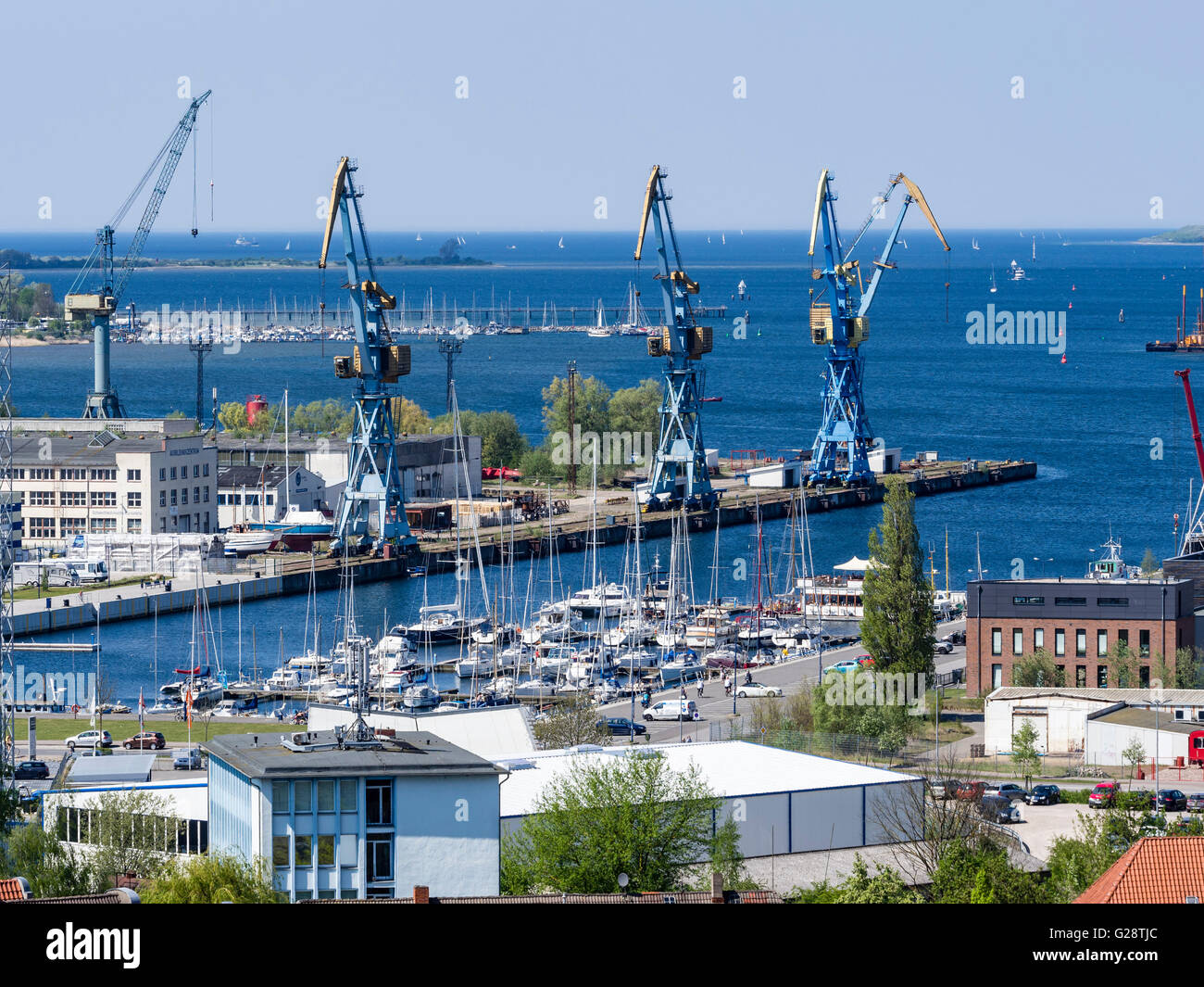 Cranes at the harbor, seen from platform of St. Georgen church, Wismar, Germany. Stock Photo
