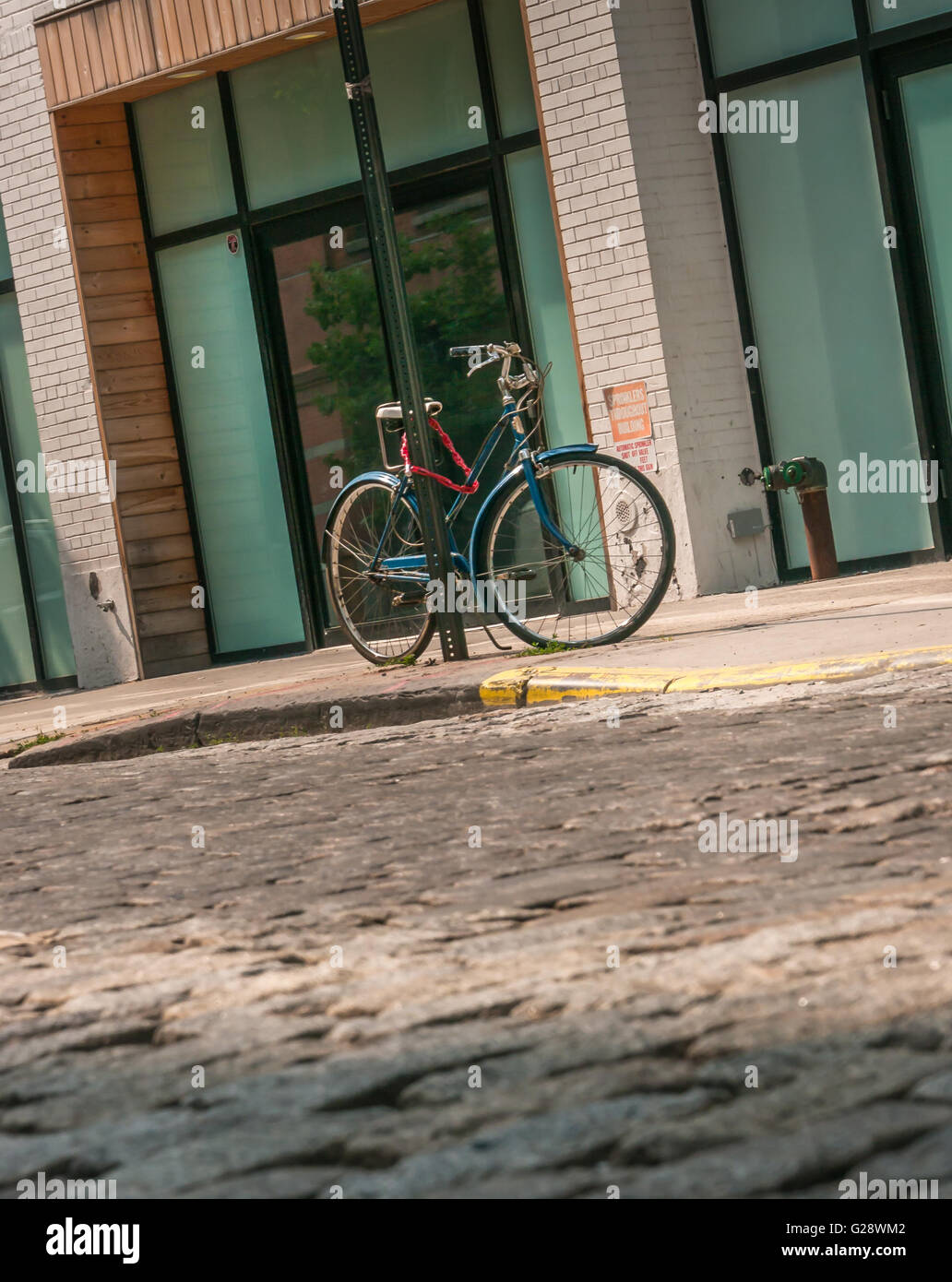 Locked bicycle in NYC Stock Photo