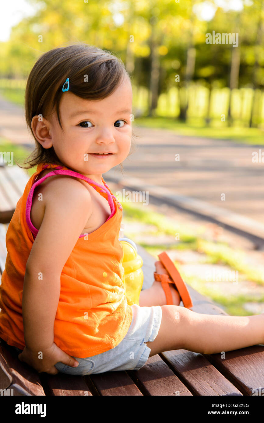 Kid playing in a city park Stock Photo