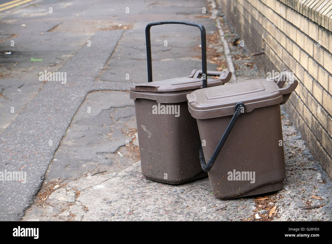 Waste food brown recycling bins left on the street for collection in Cardiff, May 2016 Stock