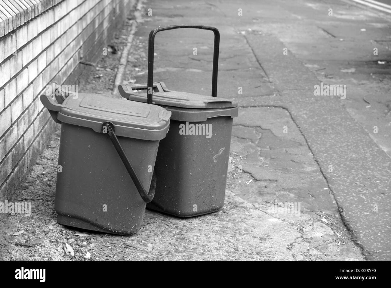 Waste food brown recycling bins left on the street for collection in Cardiff, May 2016 Stock Photo