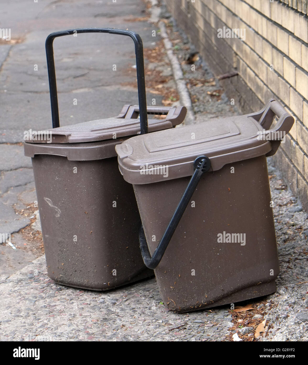 Waste food brown recycling bins left on the street for collection in