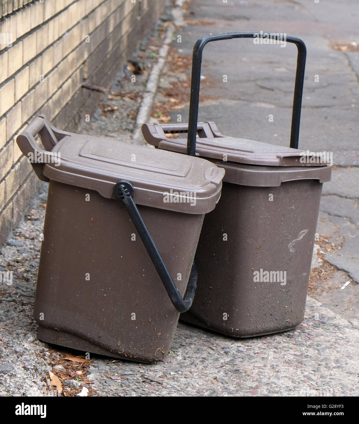 Waste food brown recycling bins left on the street for collection in