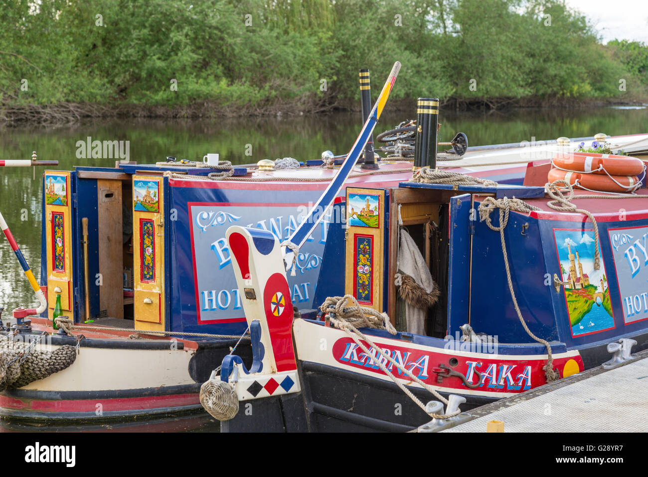 Traditional Narrowboats moored on the River Severn, England, UK Stock Photo