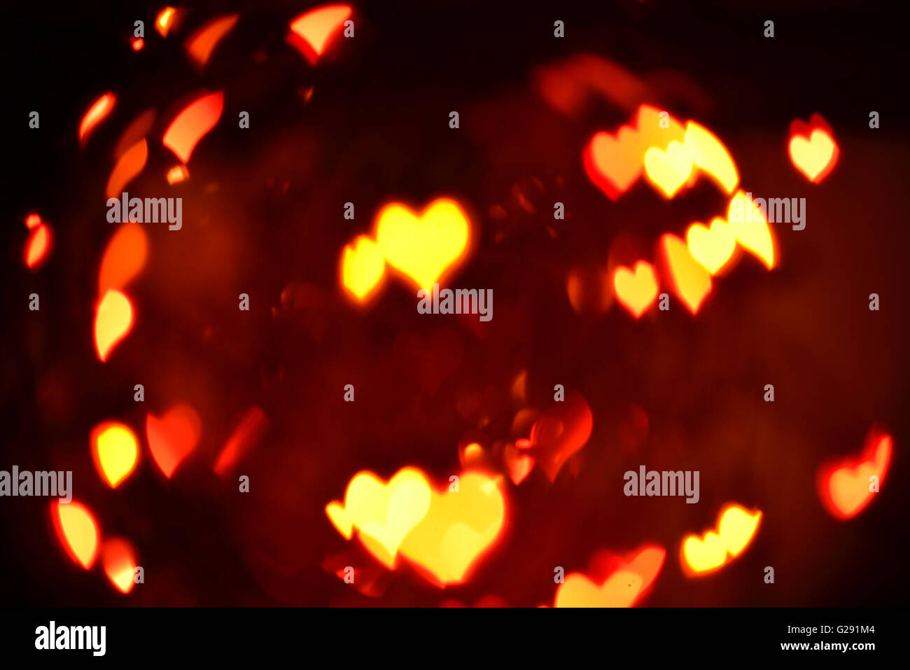 love abstract blur background (hearts particles flying in darkness Stock  Photo - Alamy