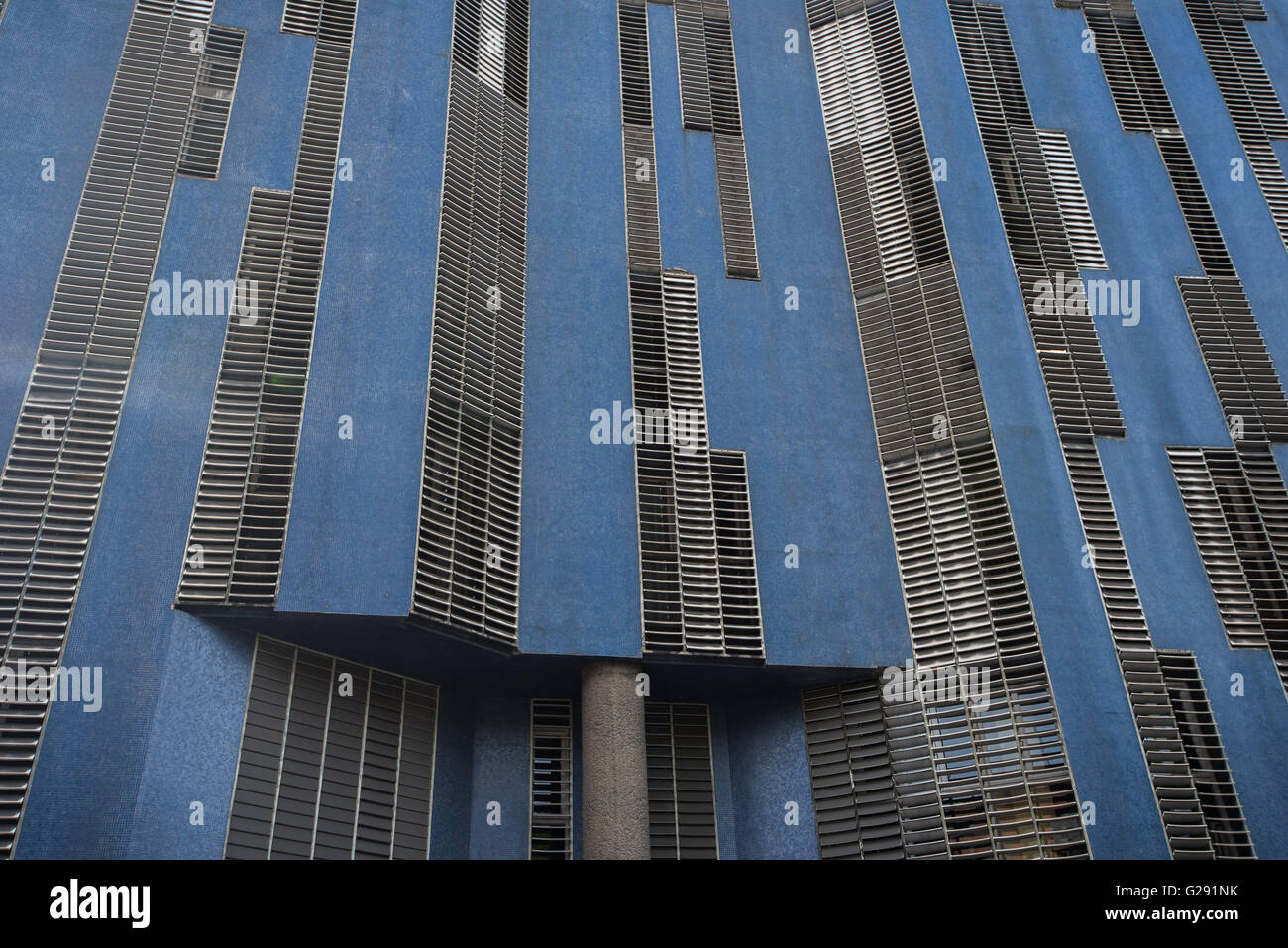 Interesting building architecture comprised of blue panels and metallic grid work Stock Photo