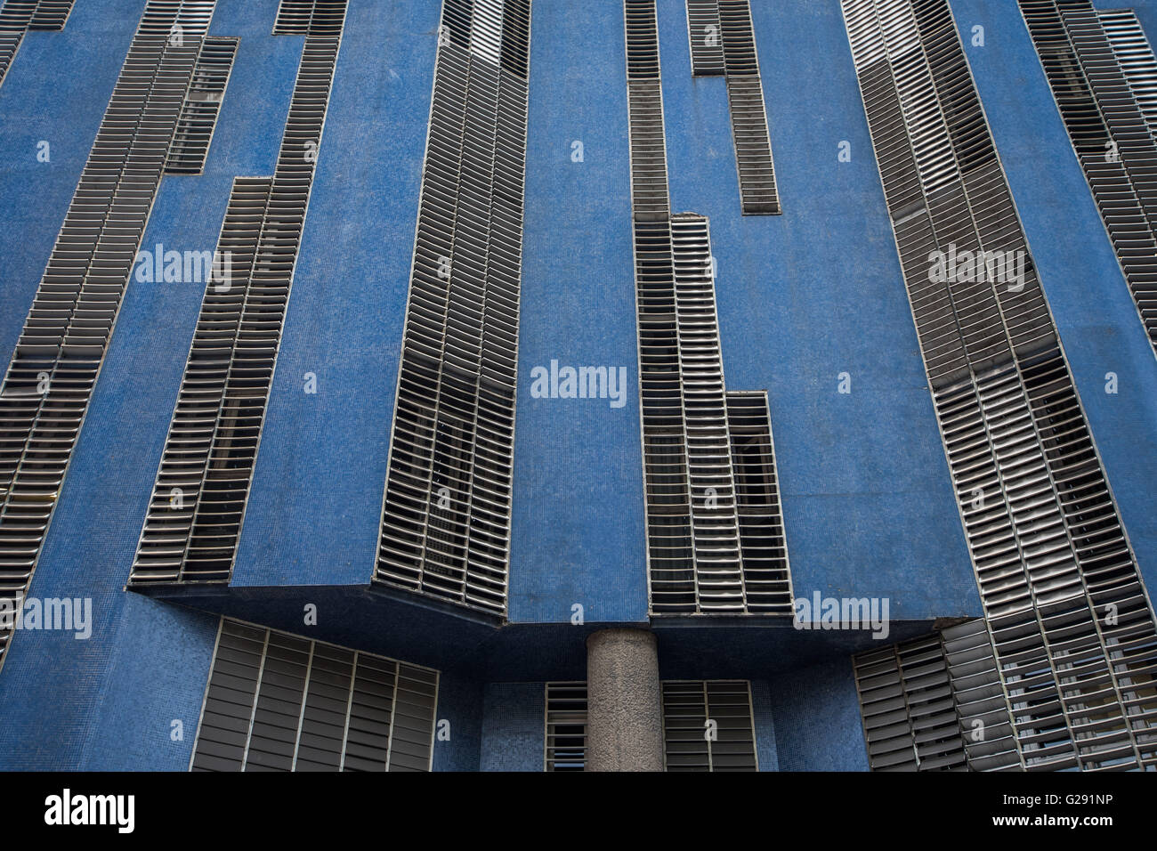 Interesting building architecture comprised of blue panels and metallic grid work Stock Photo
