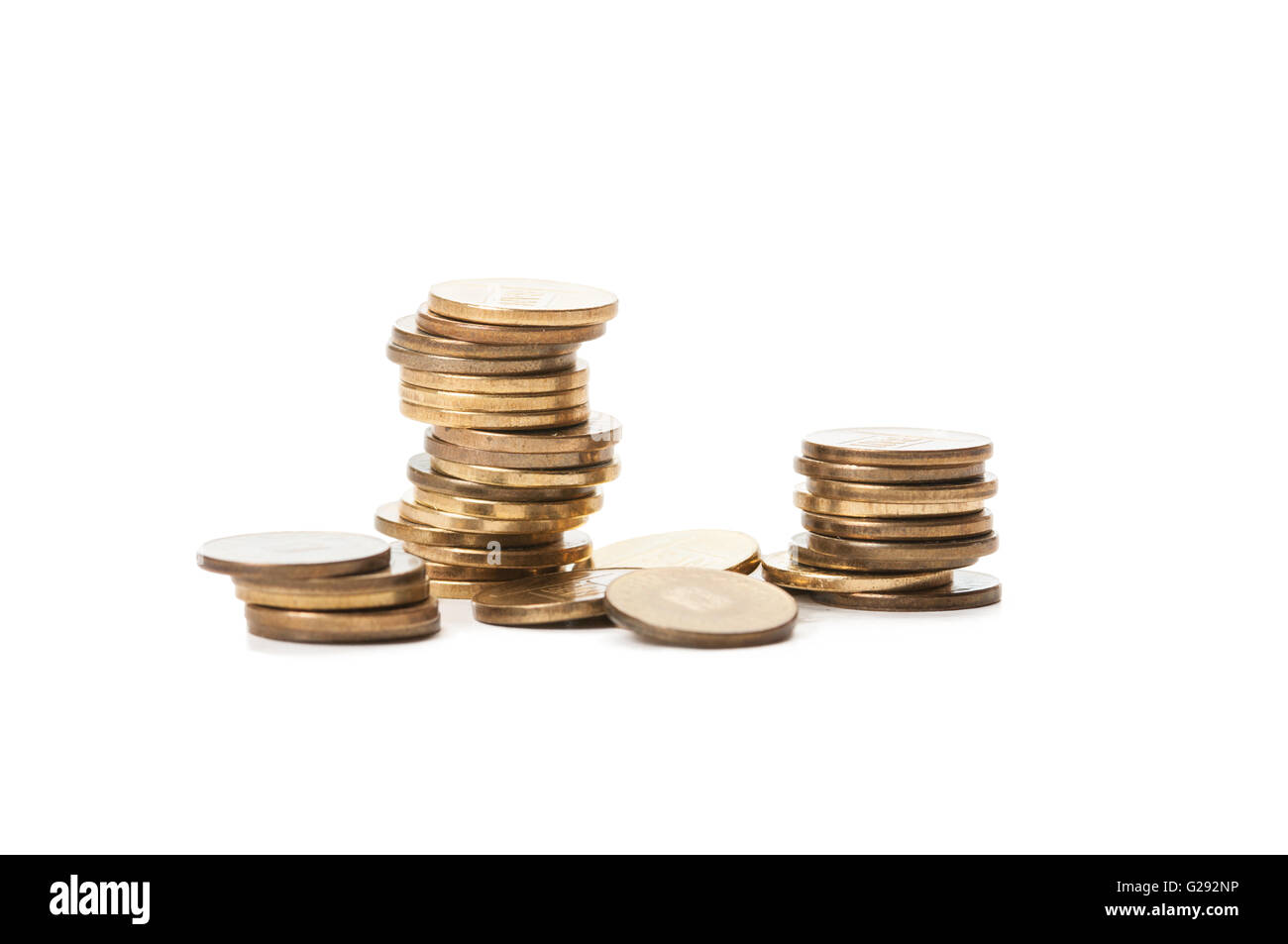 Piles of coins isolated on white background Stock Photo - Alamy