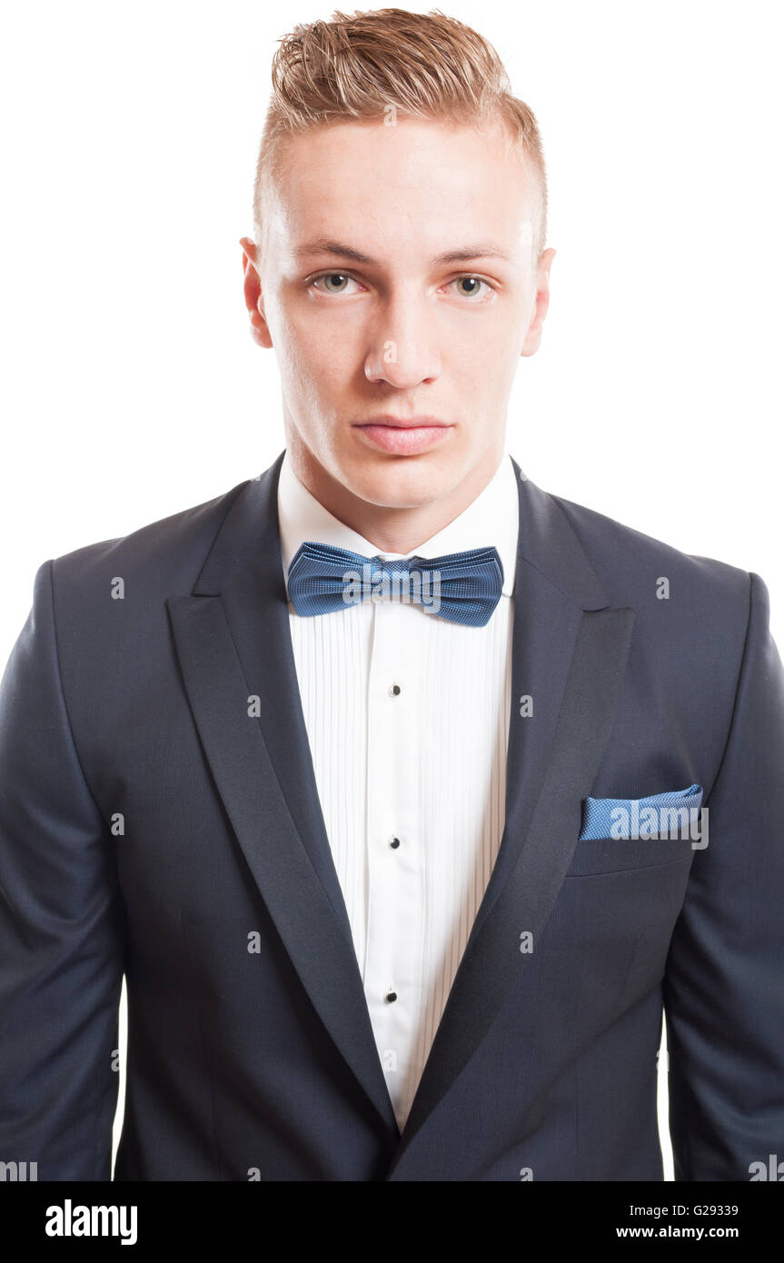 Portrait of an elegant blond male model wearing suit, shirt and bowtie ...