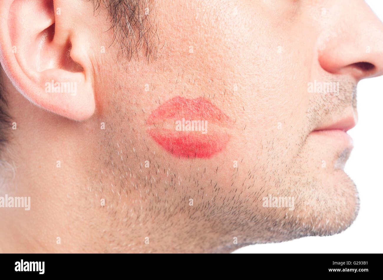 closeup-with-red-lipstick-kiss-shape-on-mans-face-G293B1.jpg