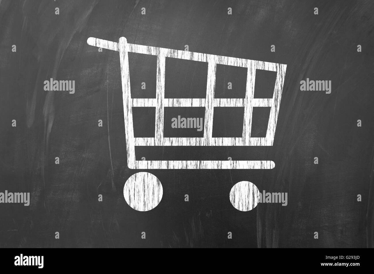 White shopping cart symbol on blackboard Stock Photo Alamy