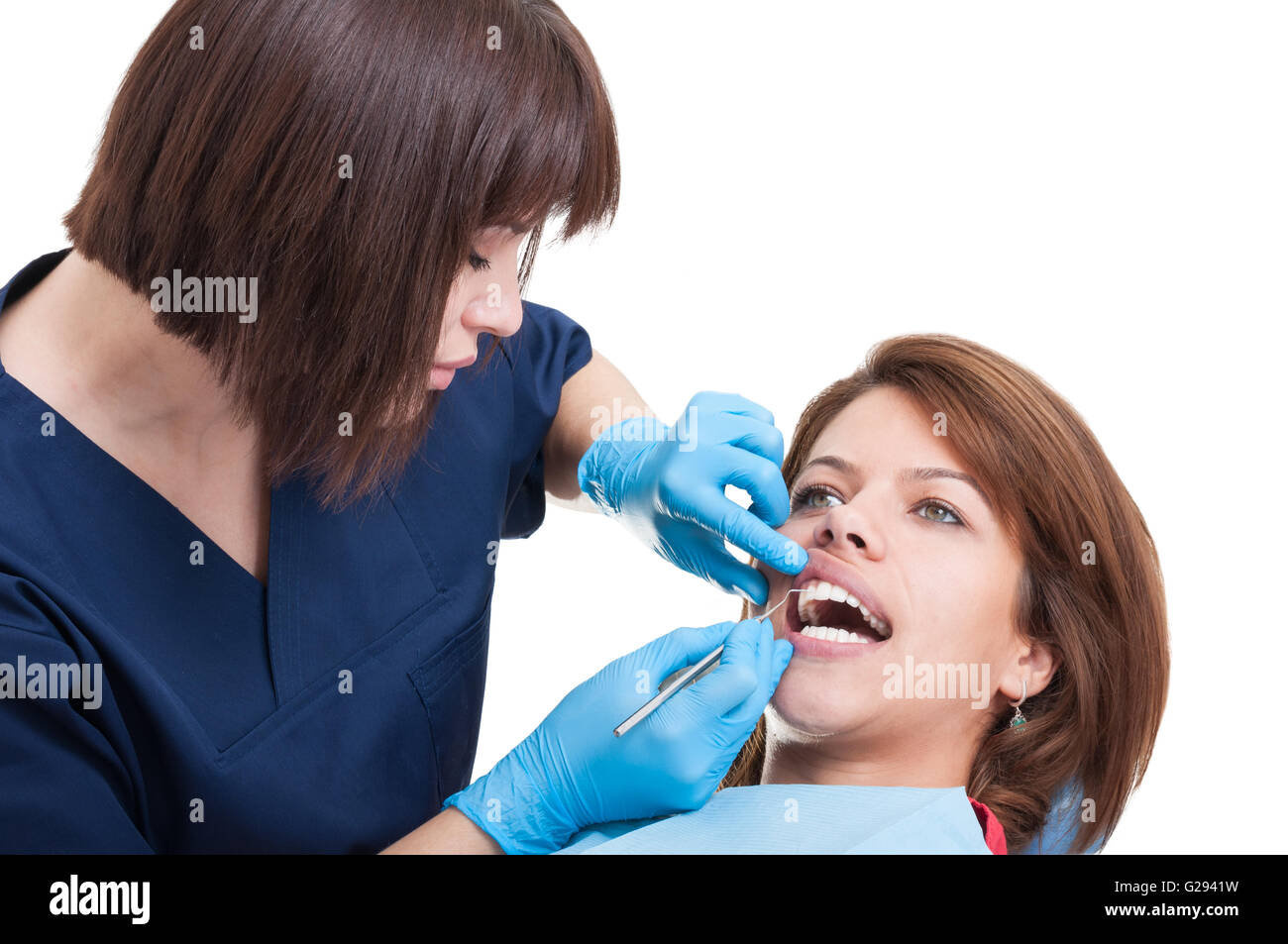Female dentist performing the periodic oral exam Stock Photo Alamy