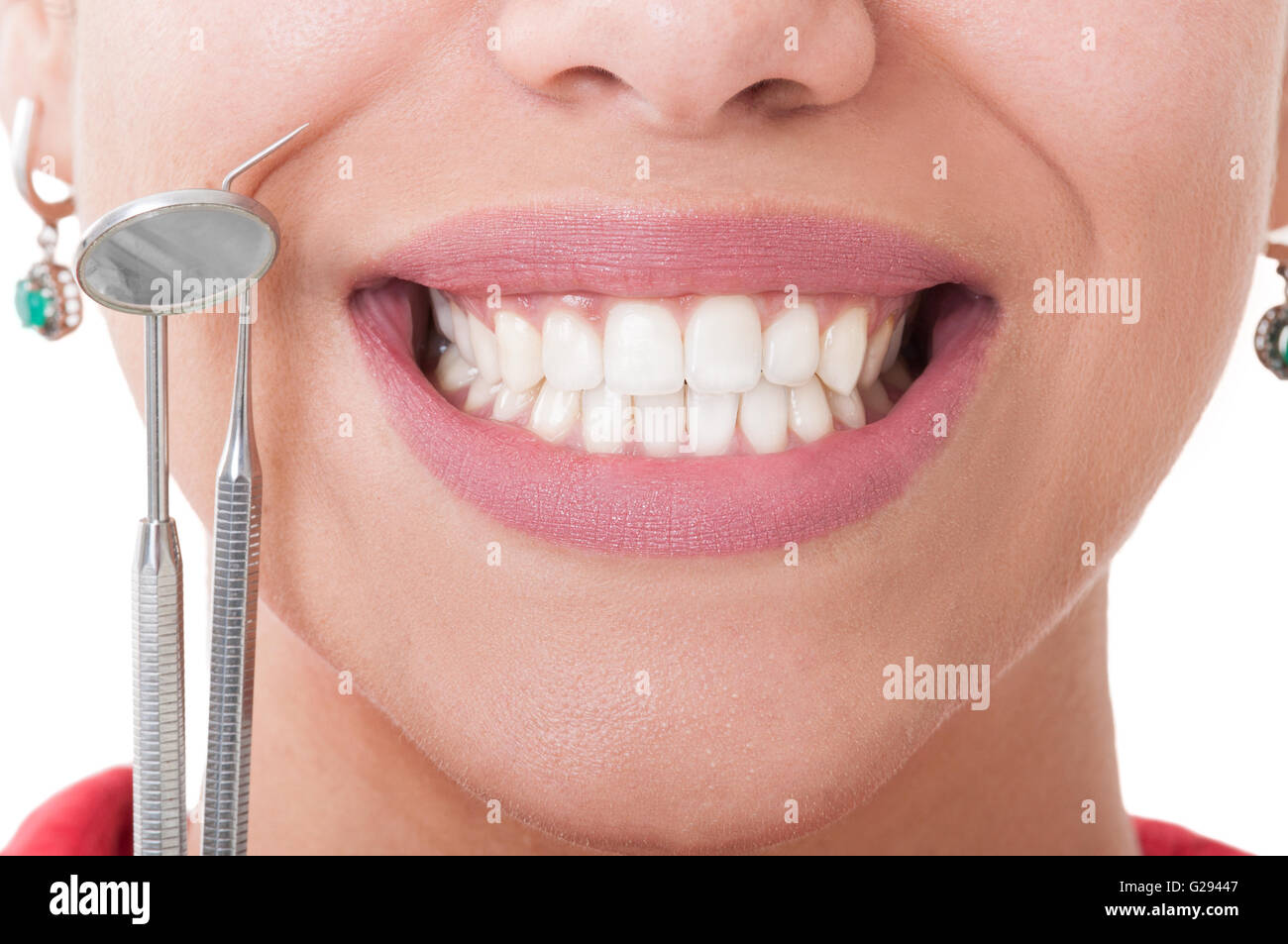 Perfect teeth and dentist tools on white background Stock Photo - Alamy