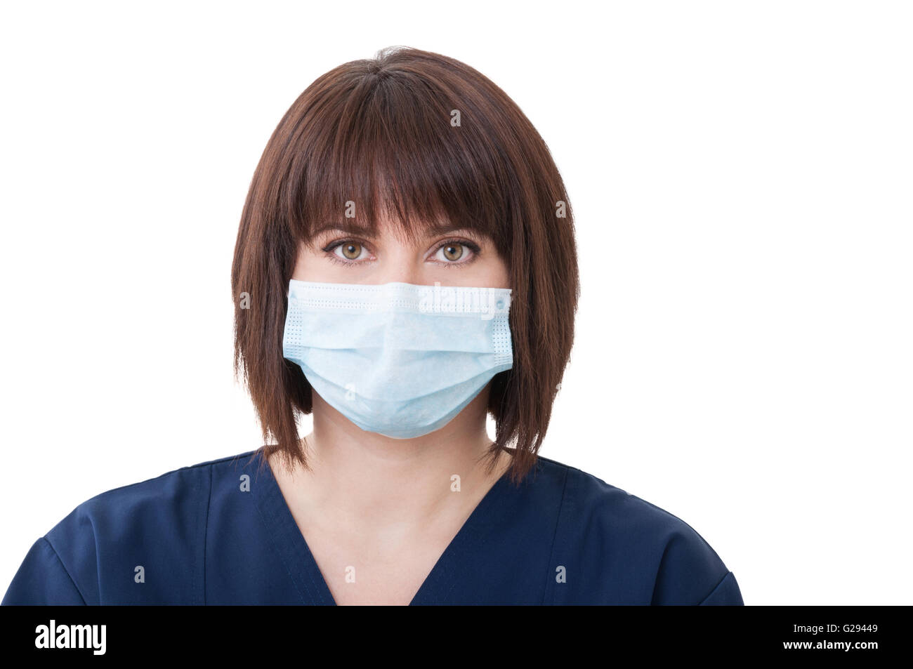 Female dentist doctor wearing protective mask on white background Stock