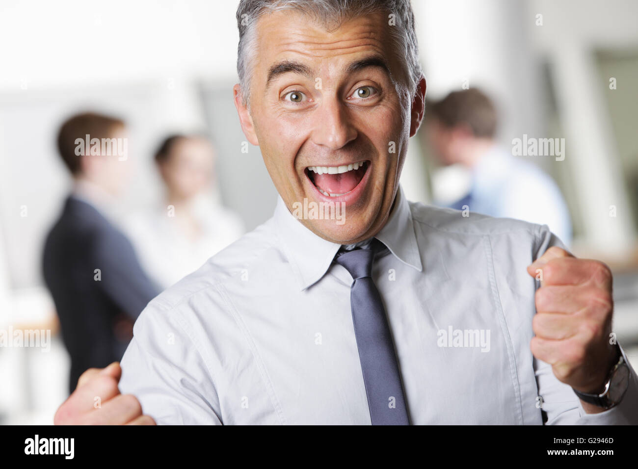 Happy business man celebrating hi-res stock photography and images - Alamy