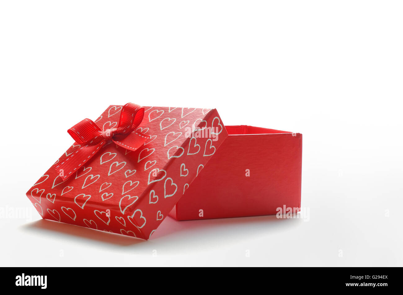 Decorative open square red gift box with red ribbon and white painted ...