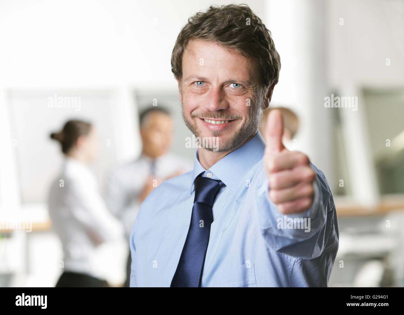 Happy Businessman Showing Thumbs Up Sign Stock Photo Alamy