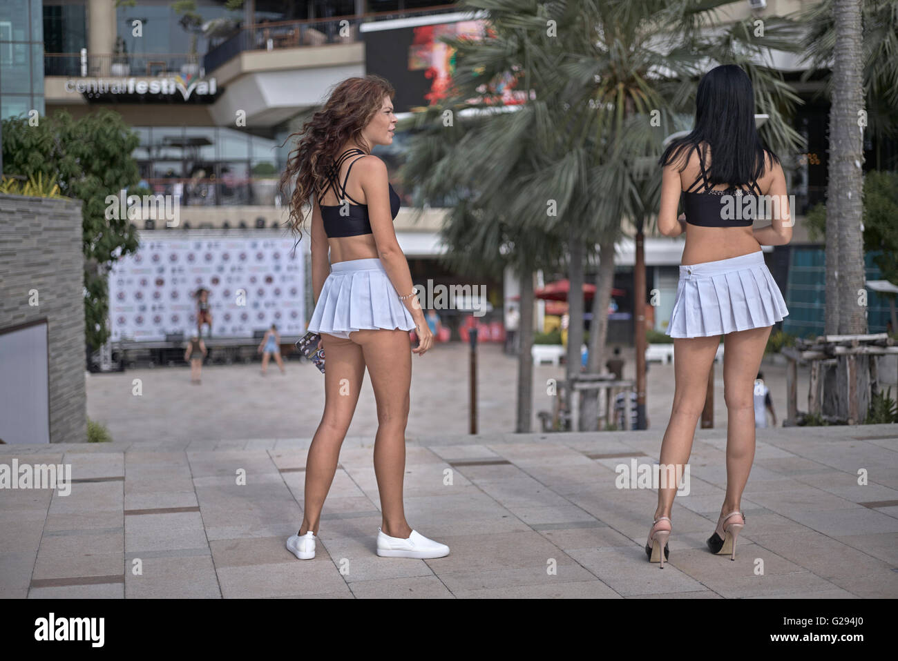 Scantily dressed show girls attracting customers. Pattaya Thailand S. E.  Asia Stock Photo - Alamy