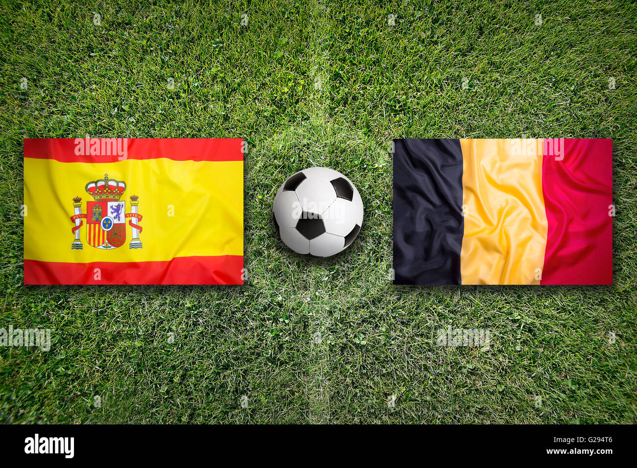 Spain vs. Belgium flags on a green soccer field Stock Photo - Alamy