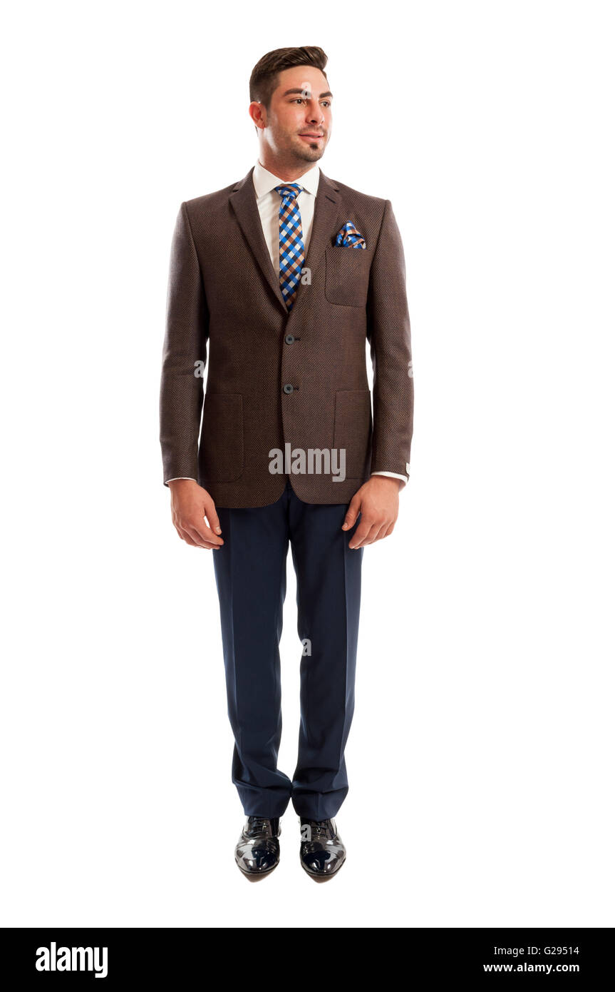 Fashionable sales man standing straight on white studio background Stock Photo