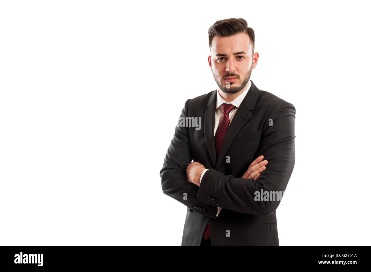 Bad and angry business man or boss crossing arms and knit the brows Stock Photo