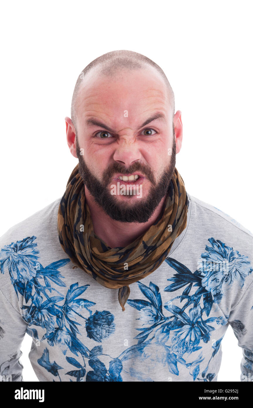Bald and bearded man making an agry face on white backgroound Stock Photo