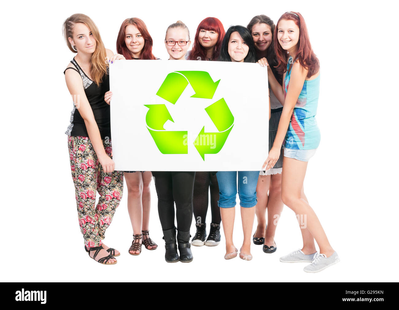Group of girls holding a big white board with green recycling sign or ...