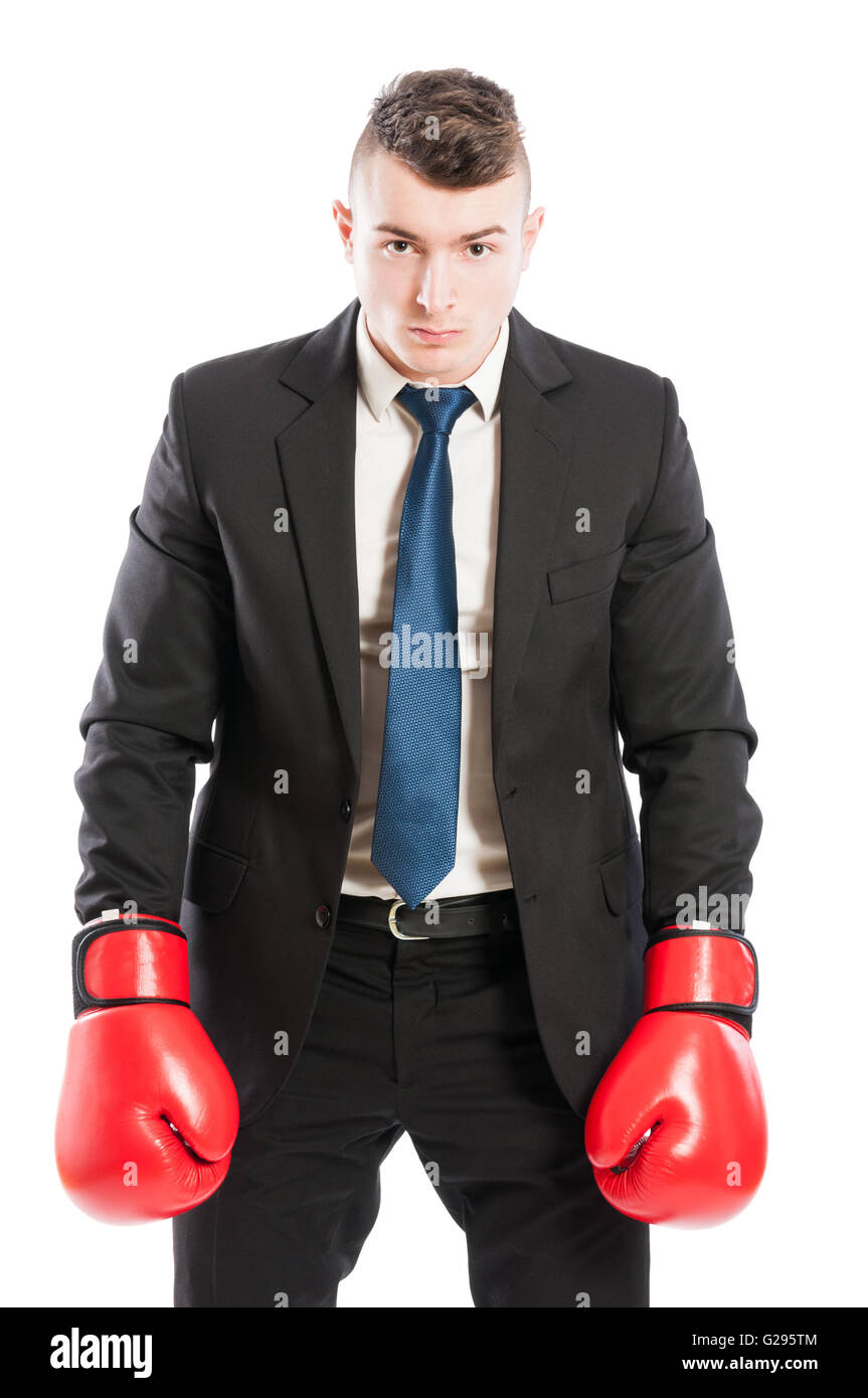 Competitive corporate boss wearing boxing gloves and black business suit Stock Photo