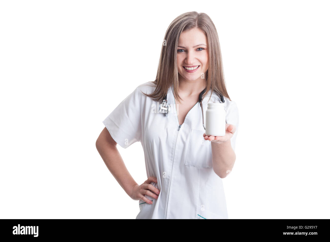 Young female doctor presenting a white unlabeled bottle or recipient of pills Stock Photo